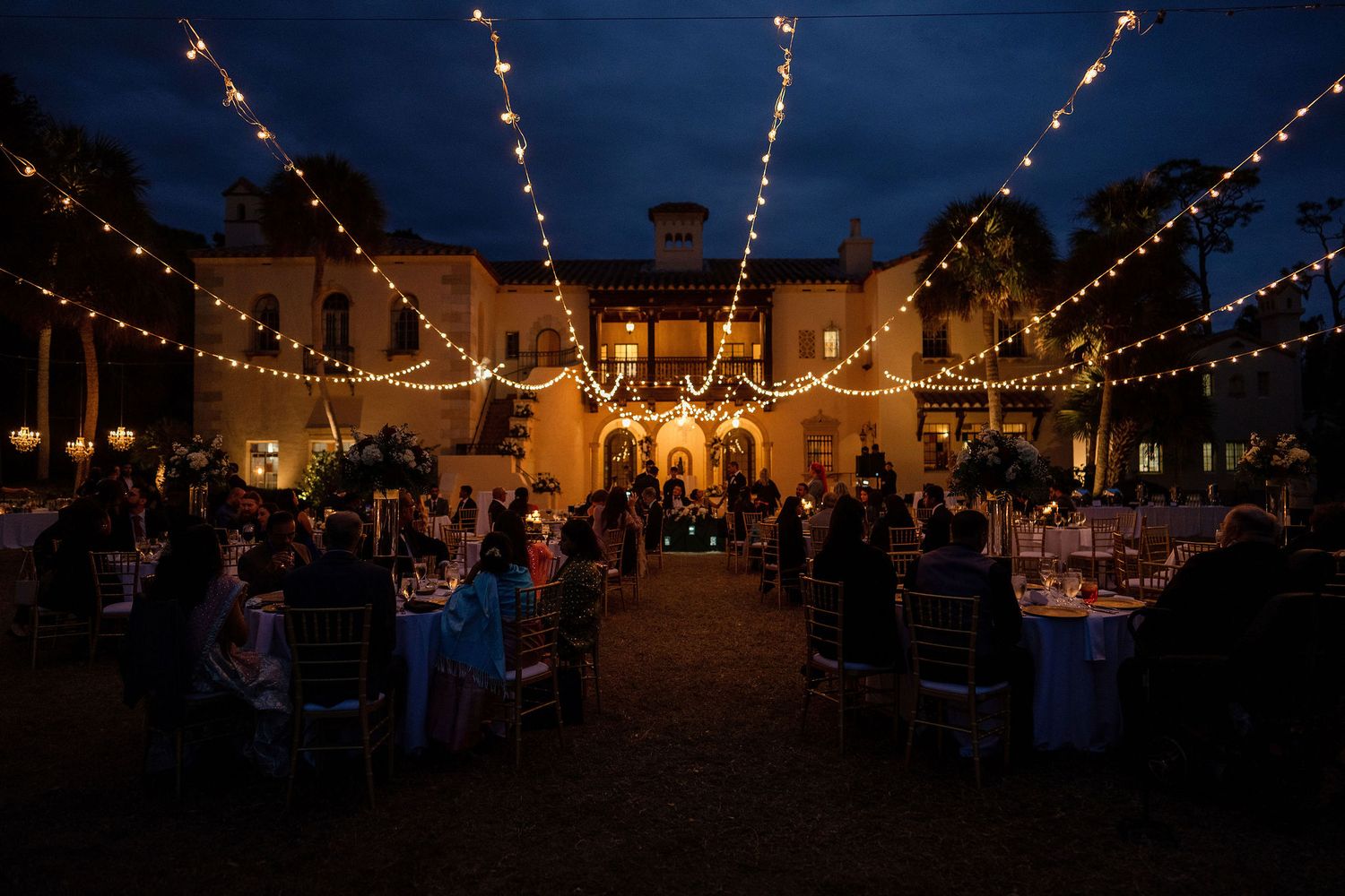 Night portrait of bride and groom on the wedding day with the Powel Crosley Estate on a background