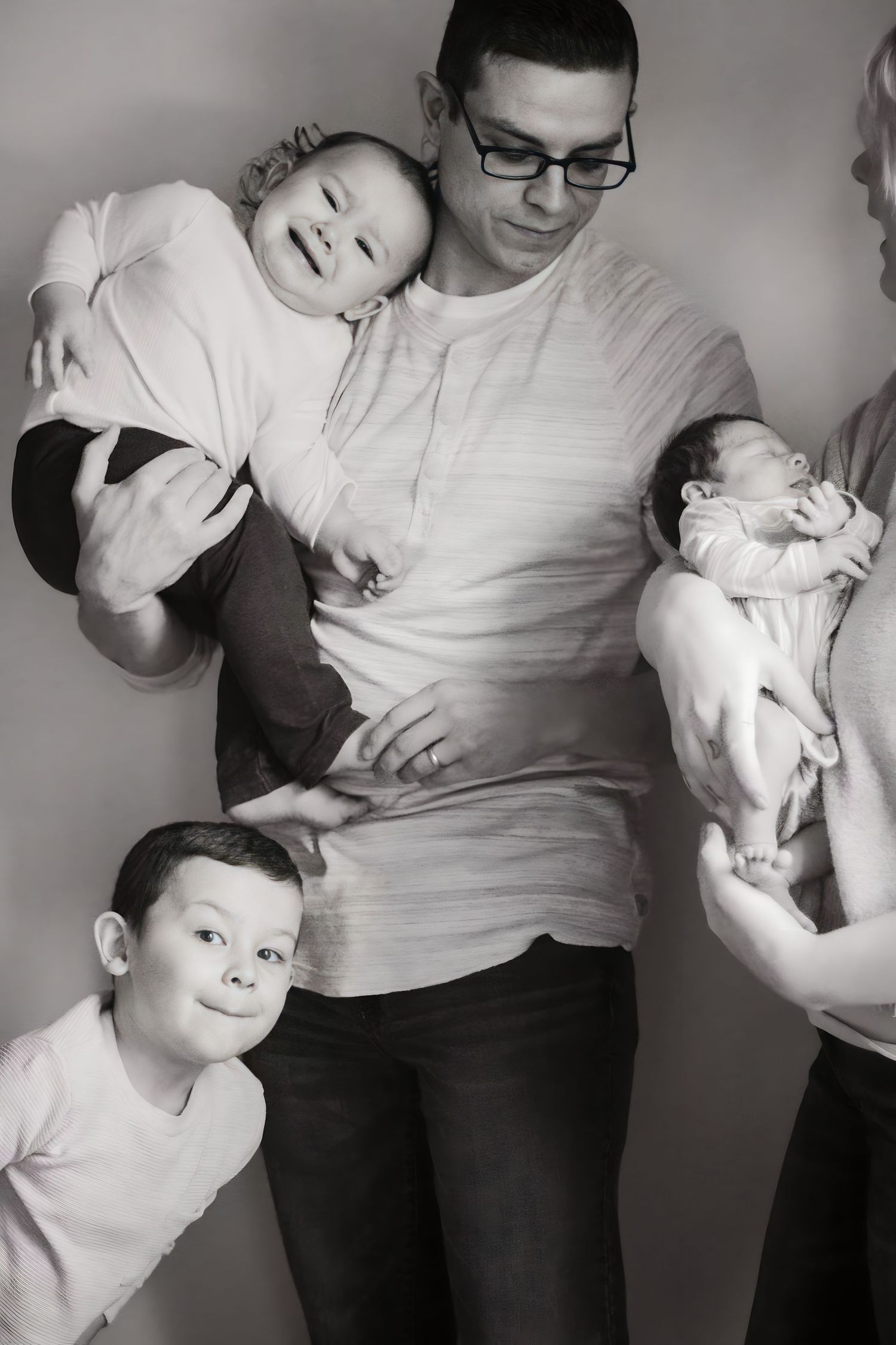 Silly family picture with only the son looking