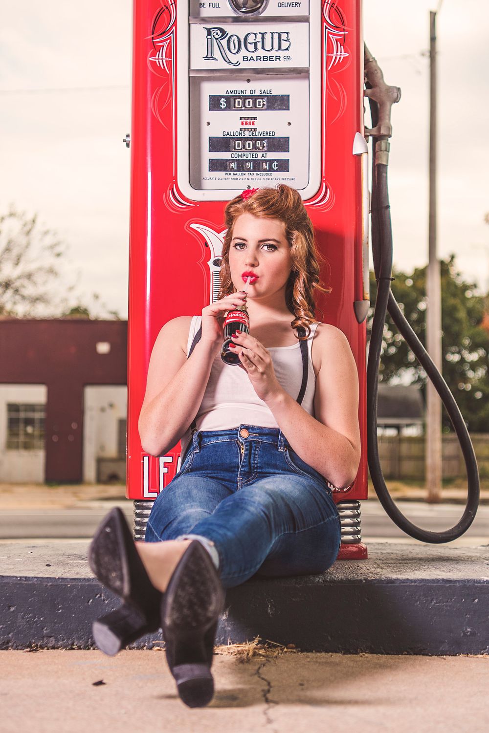 Fashion Portrait of girl in rockabilly outfit next to gas pump for model portfolio