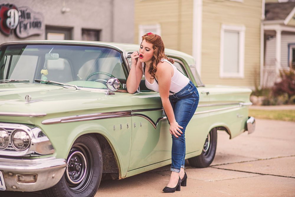 Fashion Portrait of girl in rockabilly outfit next to an Edsel for model portfolio