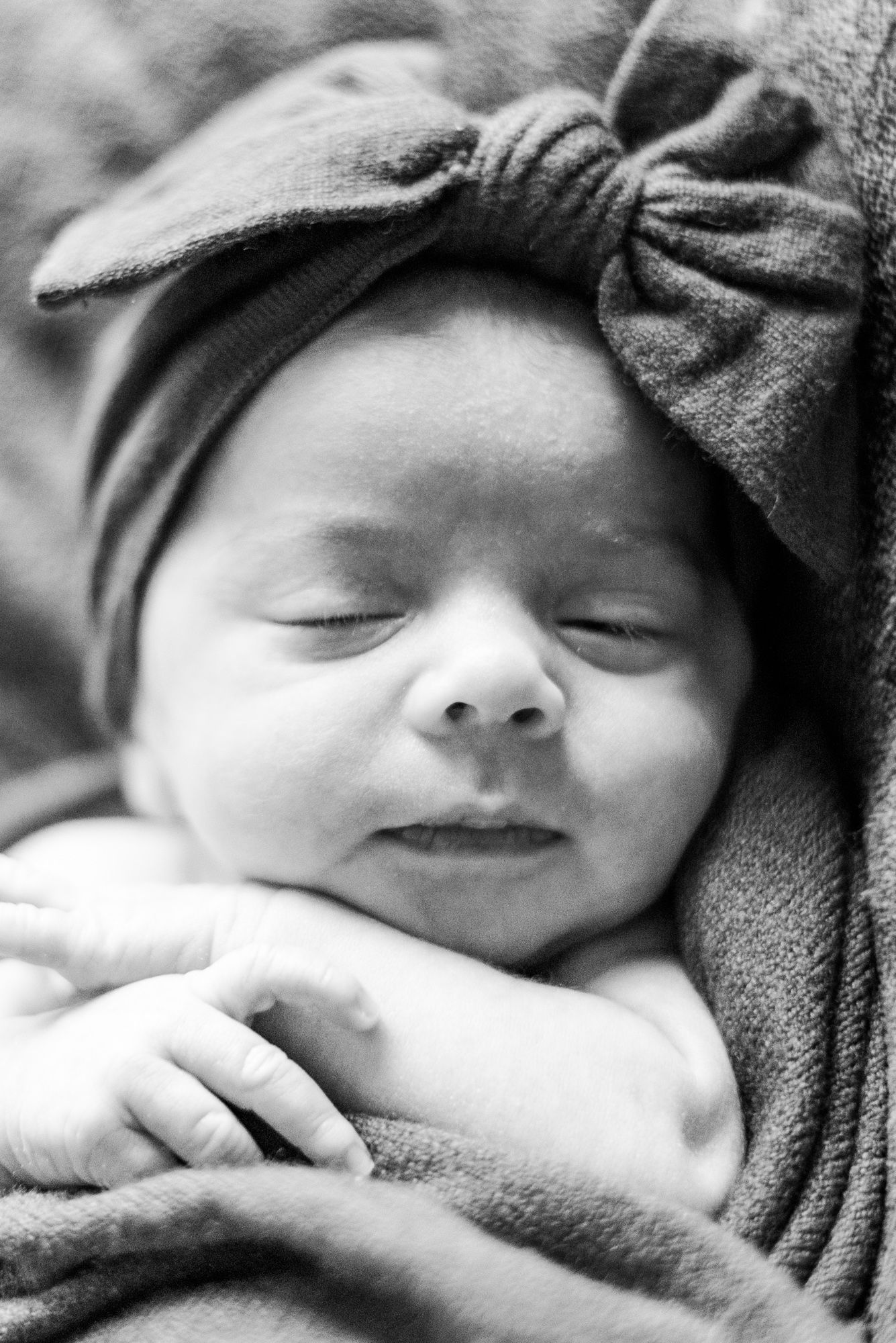 Newborn baby in pink wrap in black and white in Pittsburgh, Pennsylvania