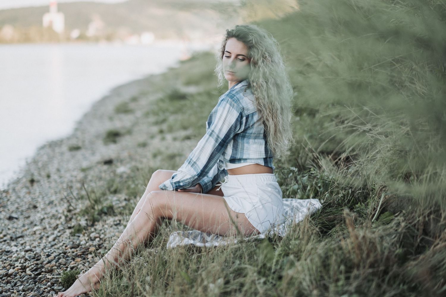Coastal fashion photography with casual summer outfit and natural lighting.