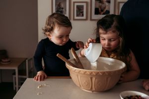 Family in home photo shoot baking