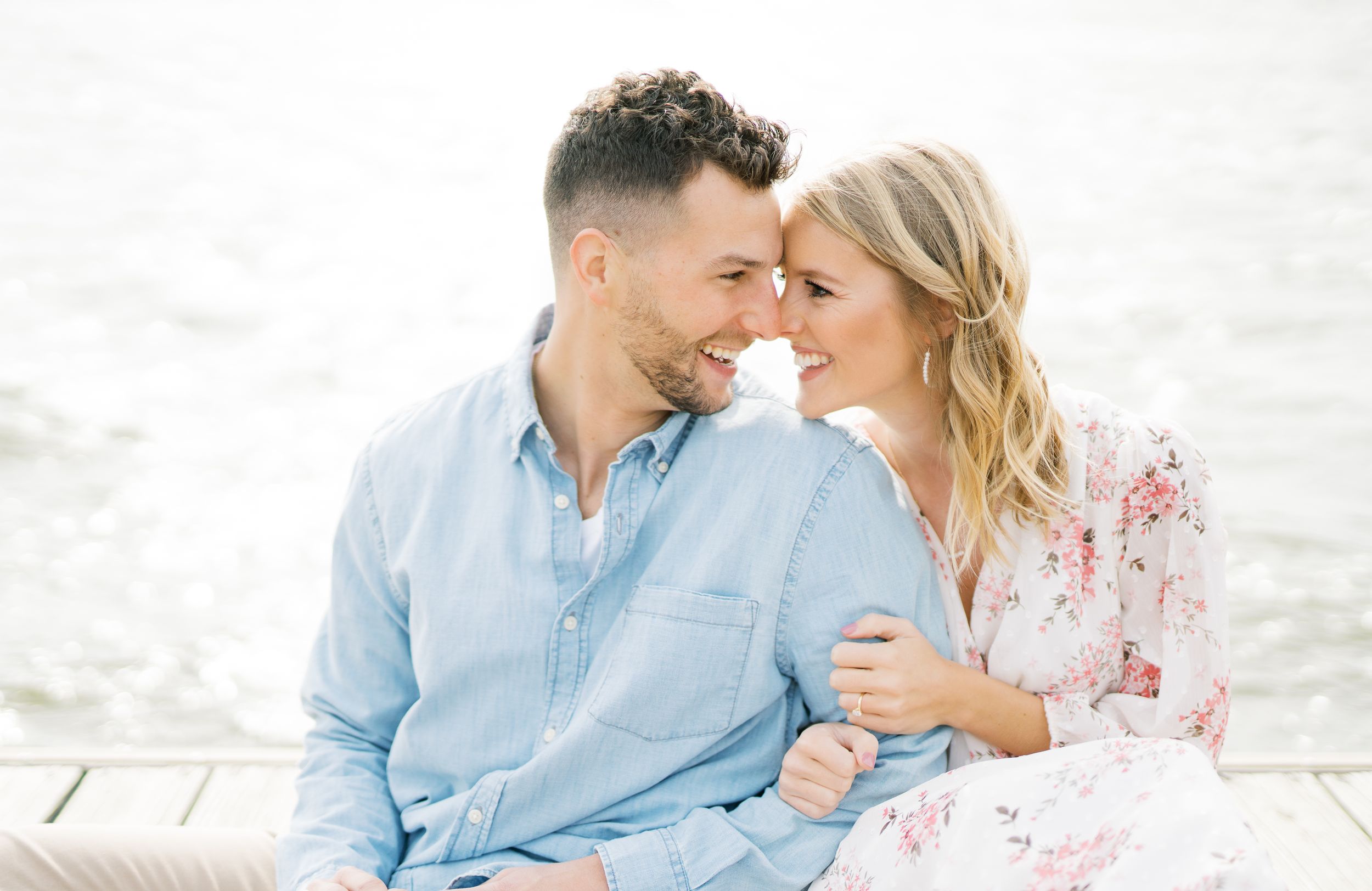 Light and airy film lakeside dock engagement session at Gray's Lake in Des Moines, Iowa