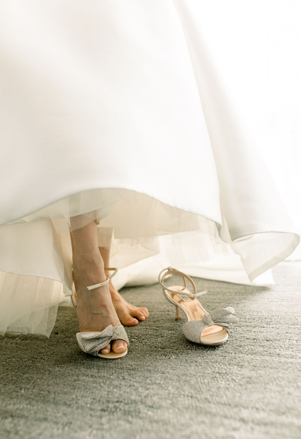 Bride putting on wedding heels in Boston