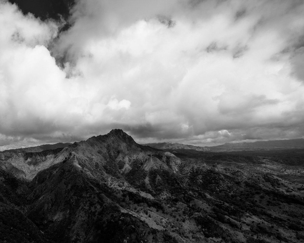 Black and white image of Hawaiian Mountain with clouds
