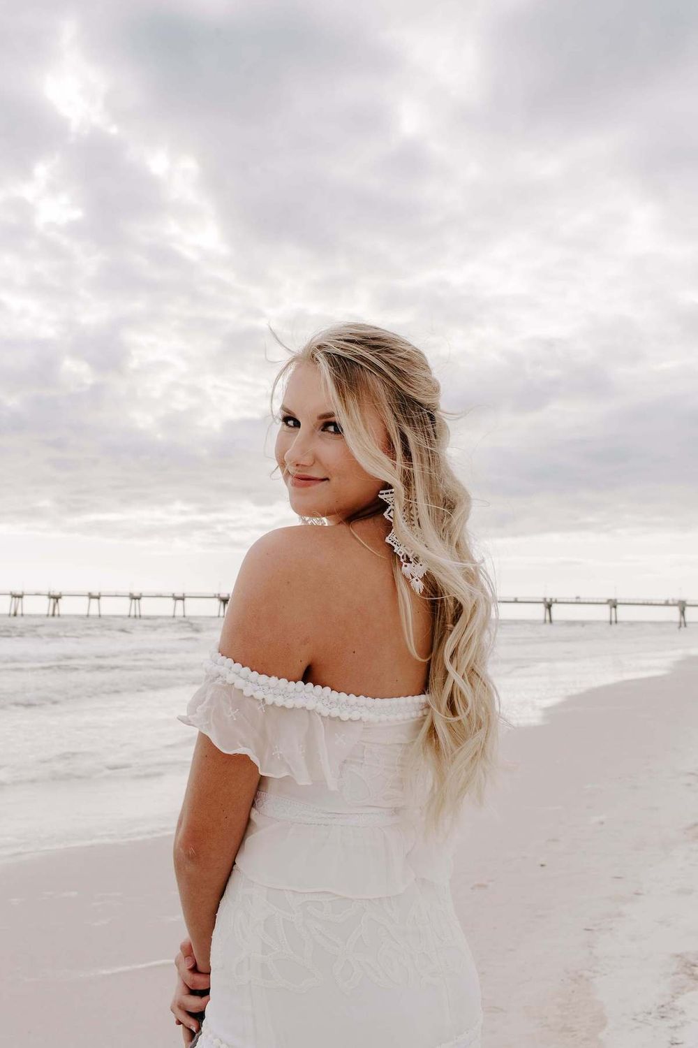 Destin, Florida destination wedding photography with bride in an off the shoulder dress after her elopement.Audrey Darke