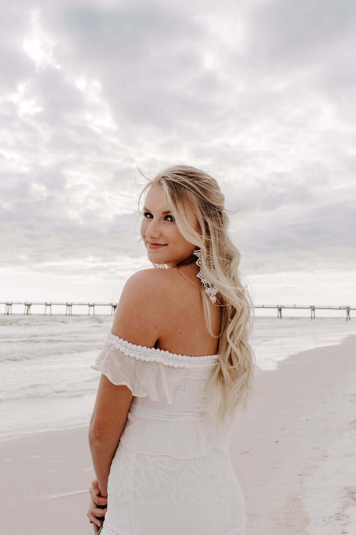 Destin, Florida destination wedding photography with bride in an off the shoulder dress after her elopement.Audrey Darke