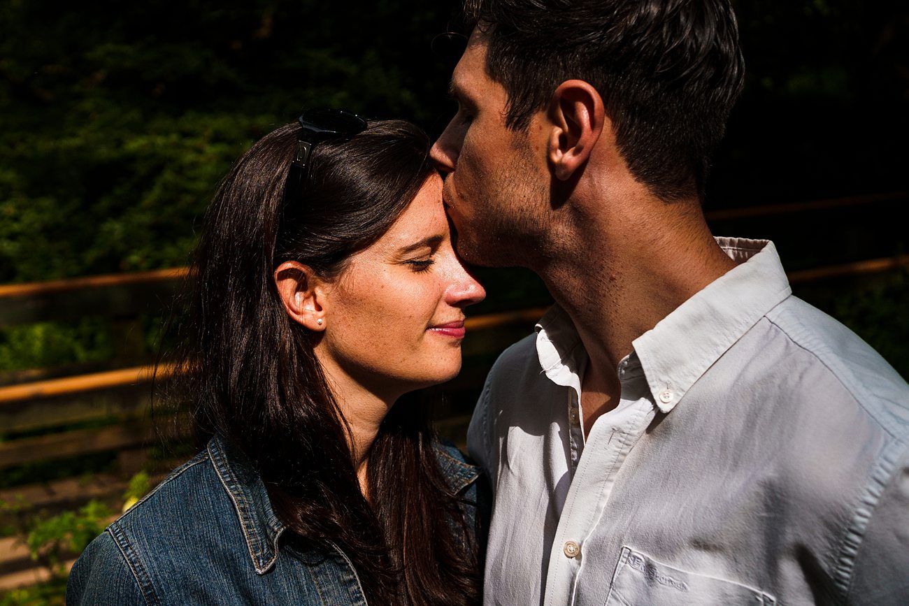 loving kiss on forehead, lady smiling with eyes closed