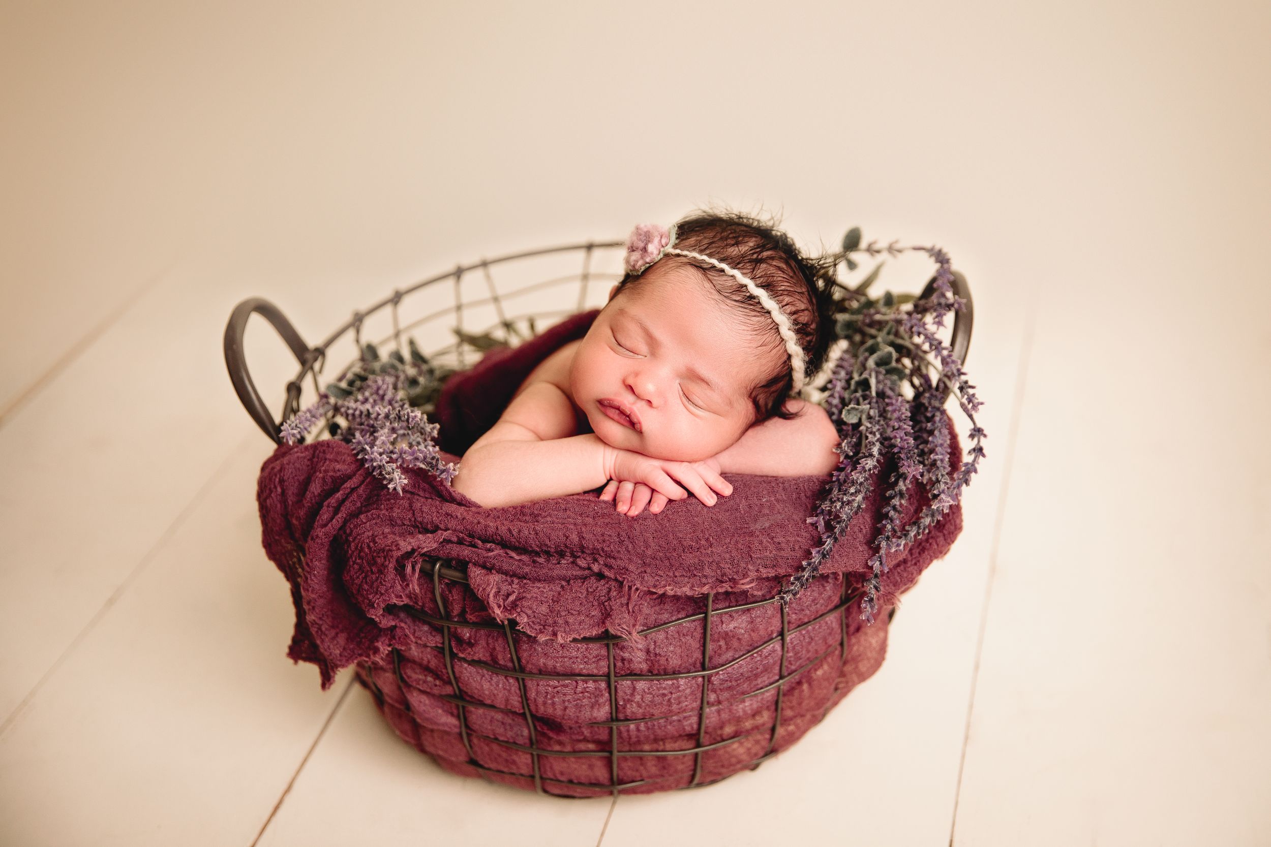 newborn baby girl in rustic style prop