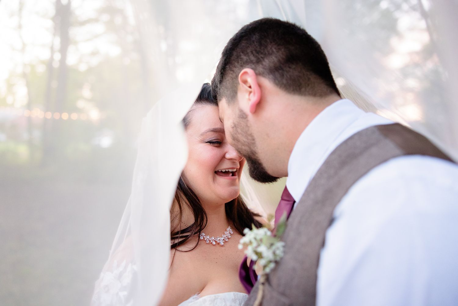 Young Bride and Groom Laughing Under the Veil Photo During Airbnb Wedding in Kent, Ohio