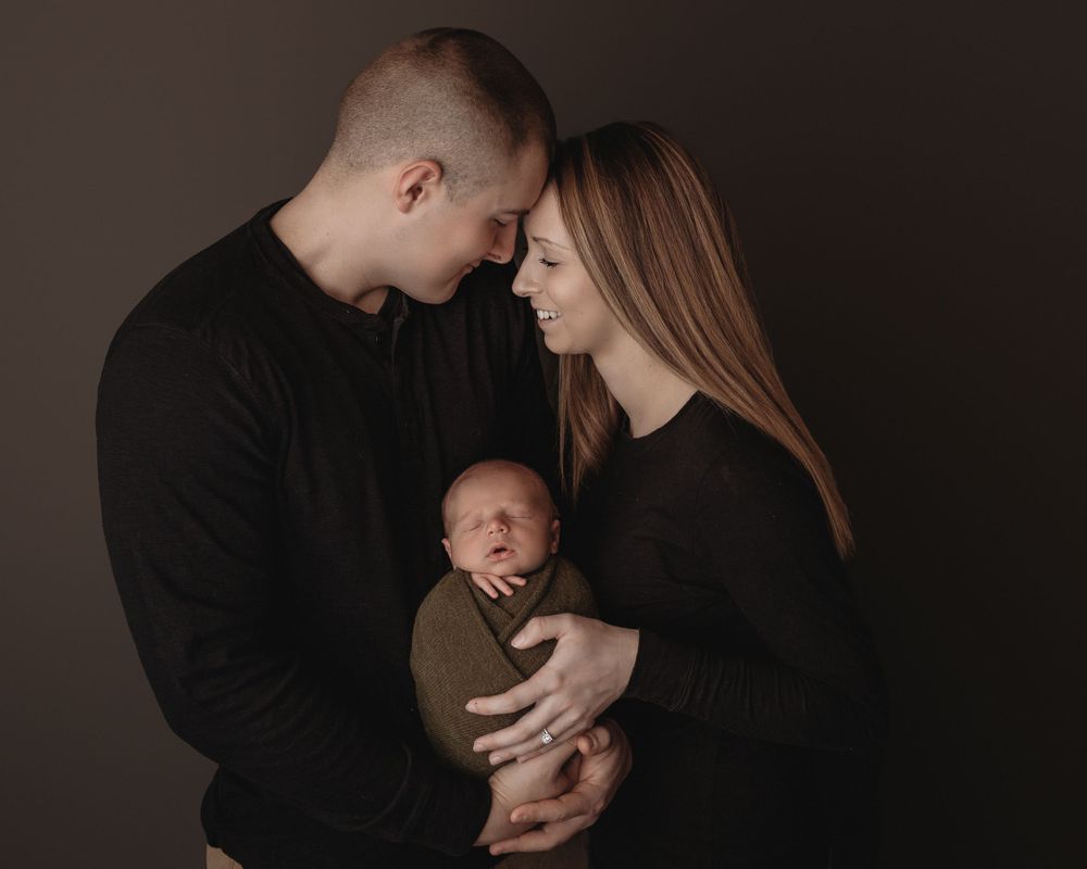 Professional newborn photo with mom and dad