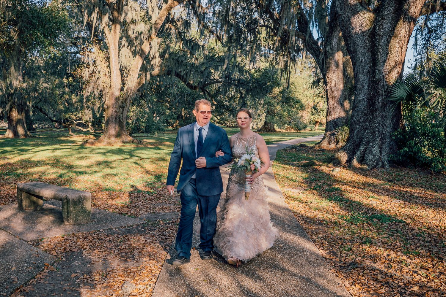 Father walking daughter to Casual wedding ceremony in New Orleans City Park