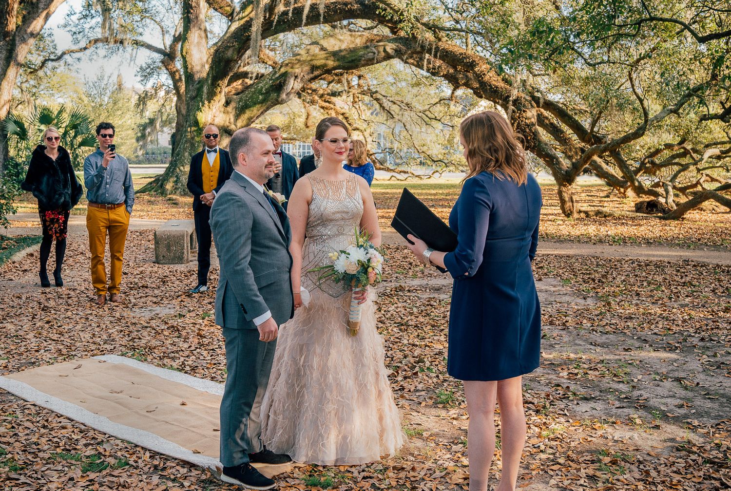 Bride and Groom taking vows at wedding ceremony in New Orleans City Park