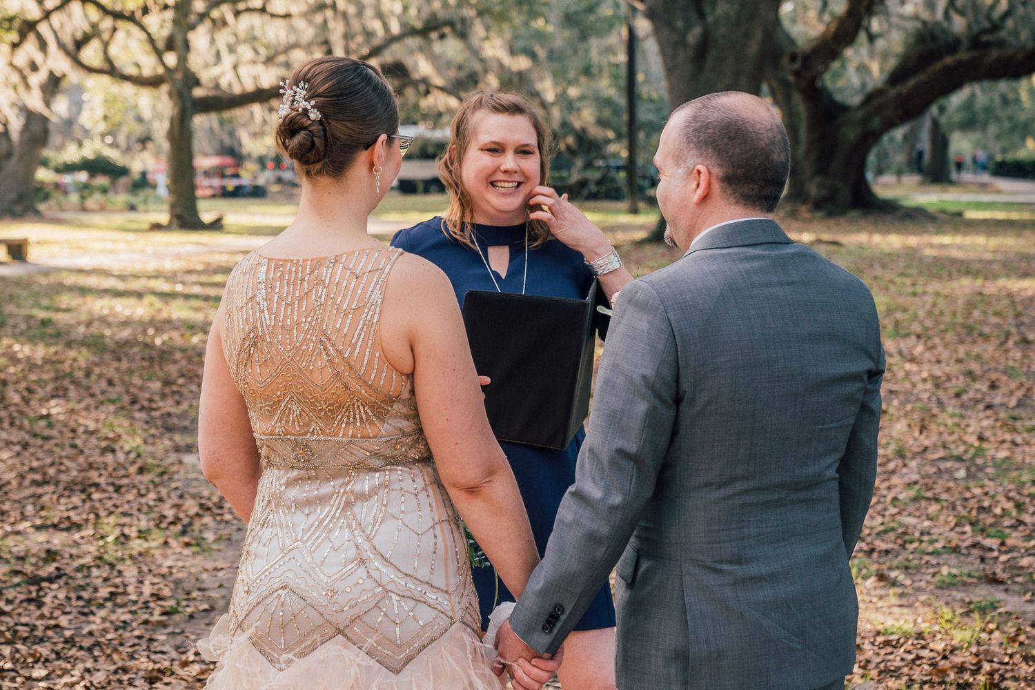 Father walking daughter to Casual wedding ceremony in New Orleans City Park