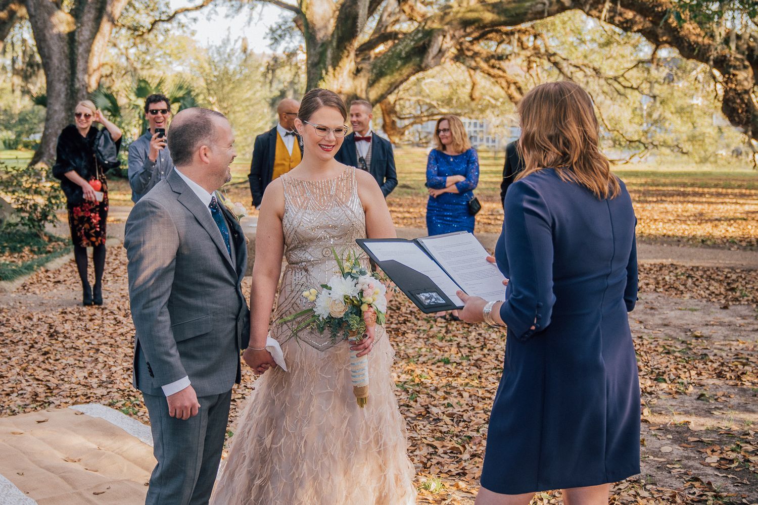 Father walking daughter to Casual wedding ceremony in New Orleans City Park