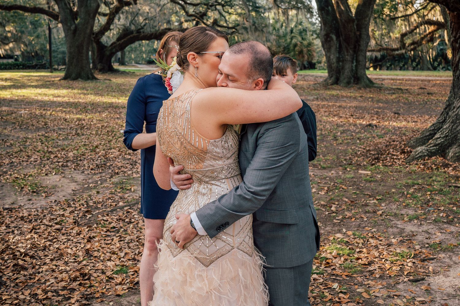 Bride and Groom hugging after wedding ceremony in New Orleans, City Park