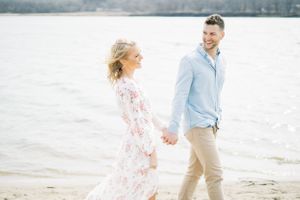 Light and airy film lakeside dock engagement session at Gray's Lake in Des Moines, Iowa