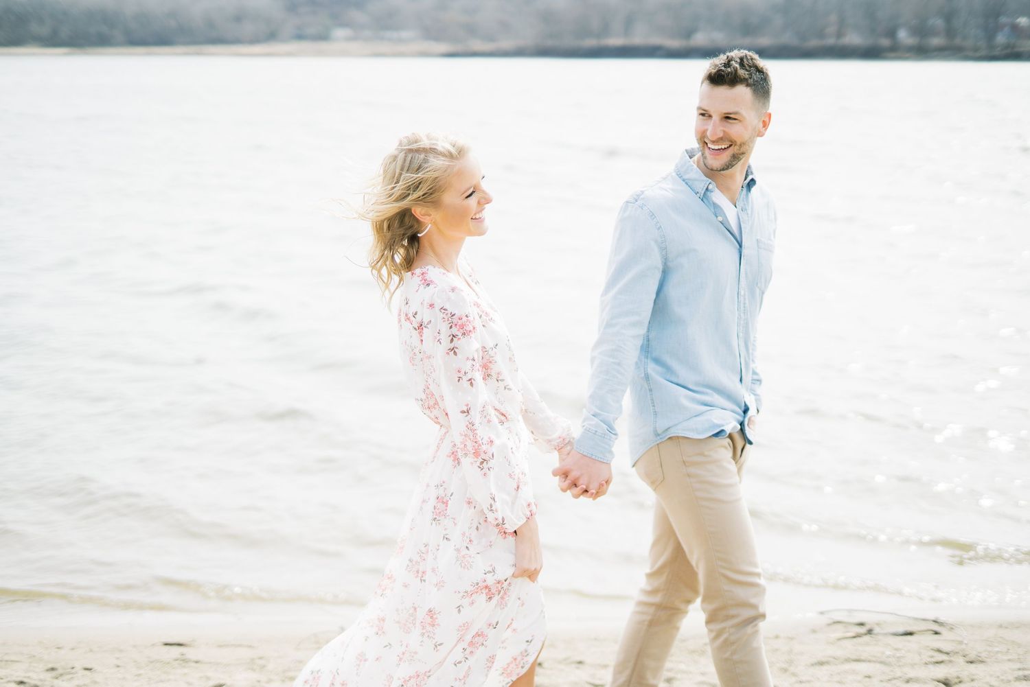 Light and airy film lakeside dock engagement session at Gray's Lake in Des Moines, Iowa