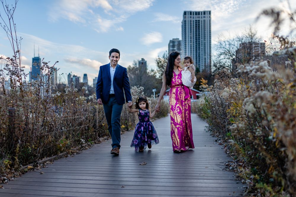 family of four walking in the nature riverwalk Chicago family lifestyle session
