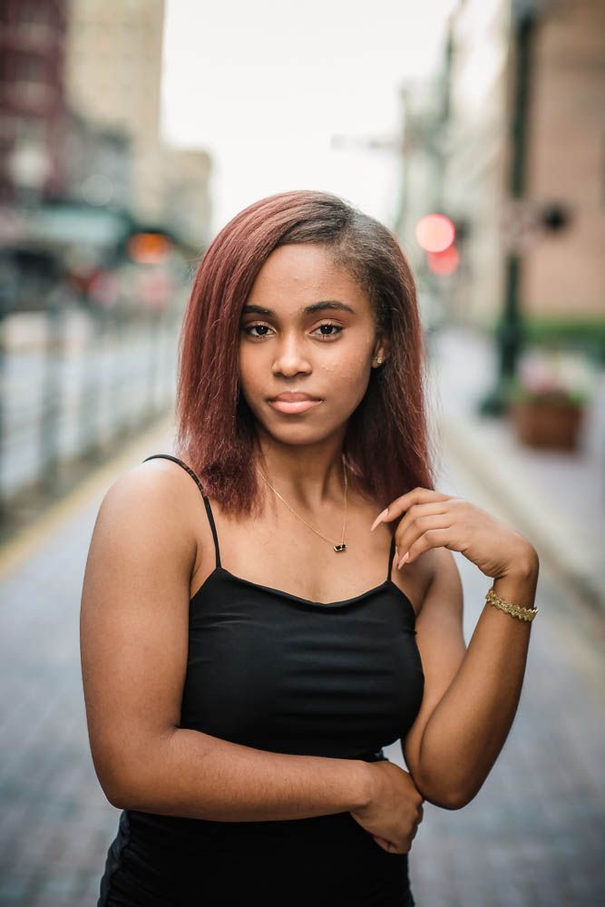 Girl High School Senior Downtown in Street with MetroRail behind