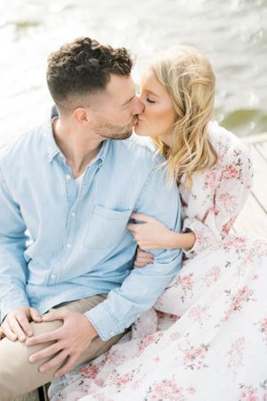 Light and airy film lakeside dock engagement session at Gray's Lake in Des Moines, Iowa