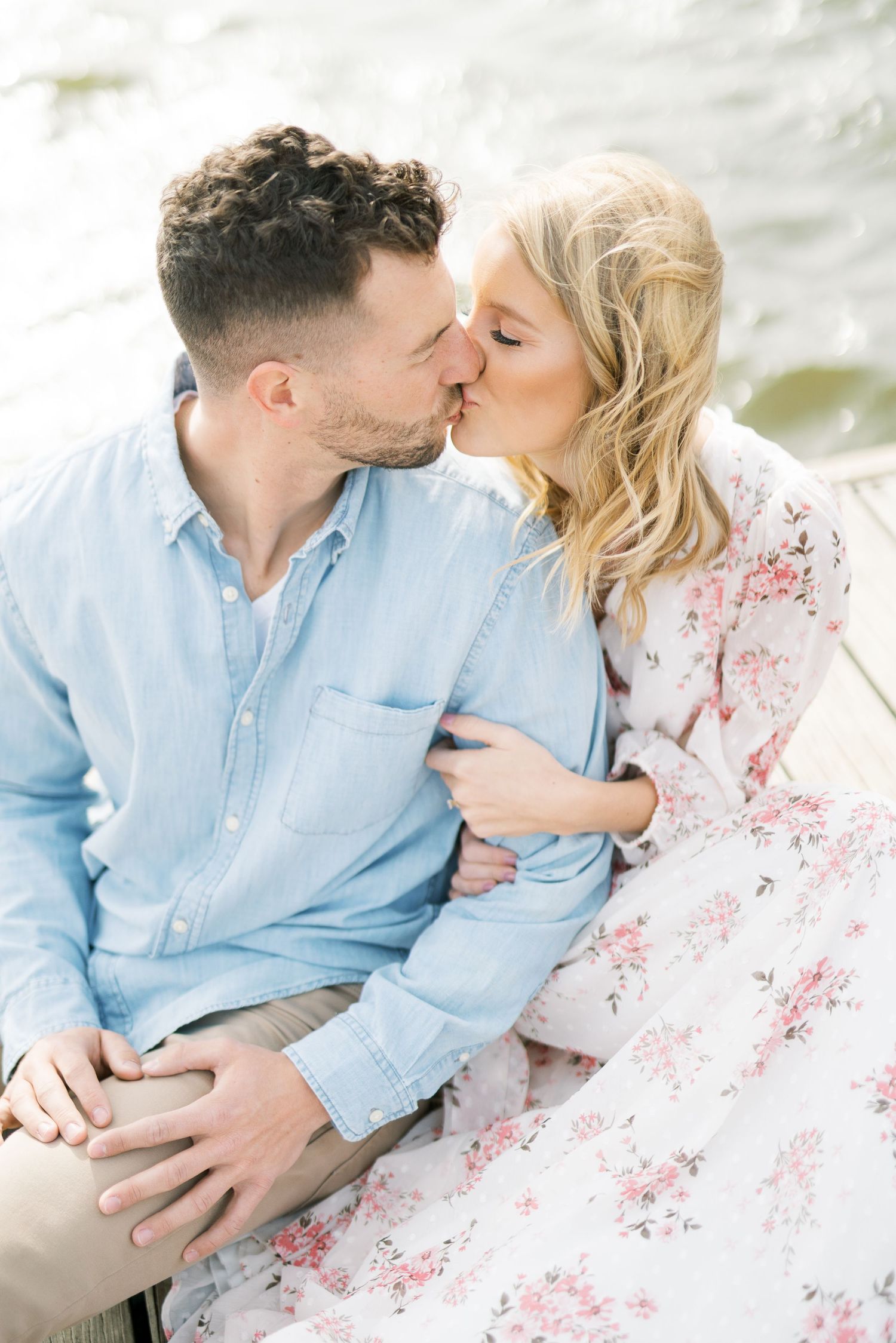 Light and airy film lakeside dock engagement session at Gray's Lake in Des Moines, Iowa