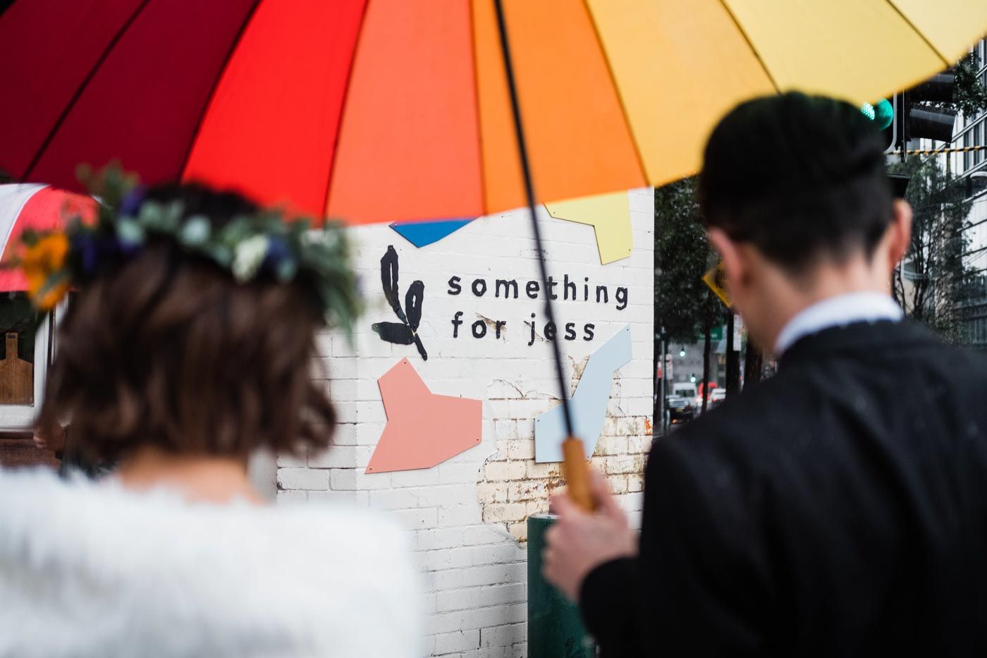 Elopement Bride and Groom under an umbrella in the rain
