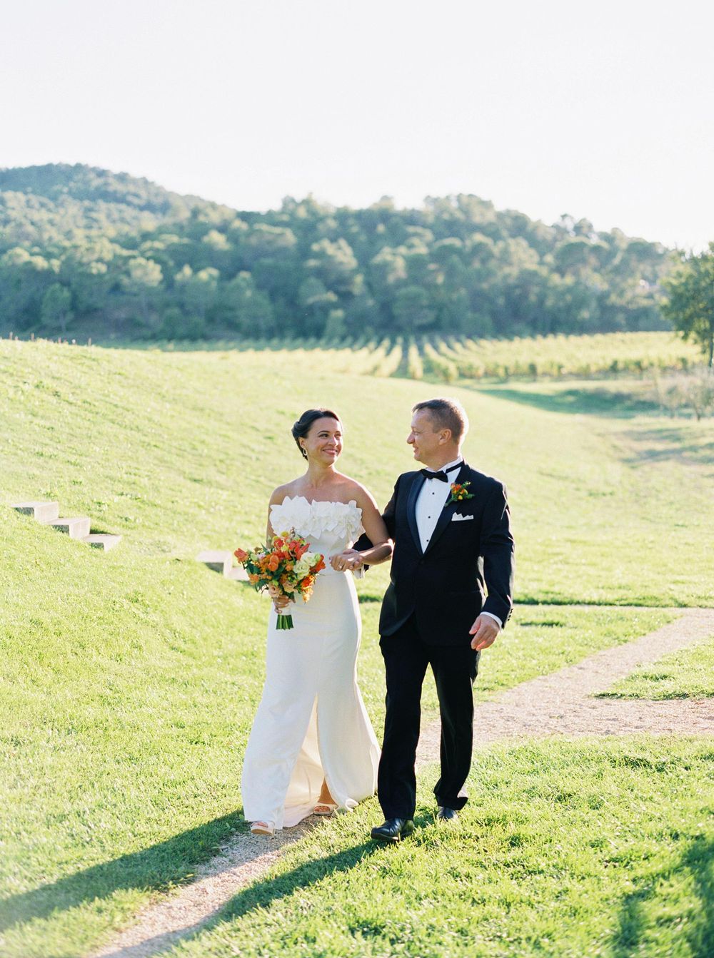 The bride gracefully enters the ceremony, radiating elegance and joy.