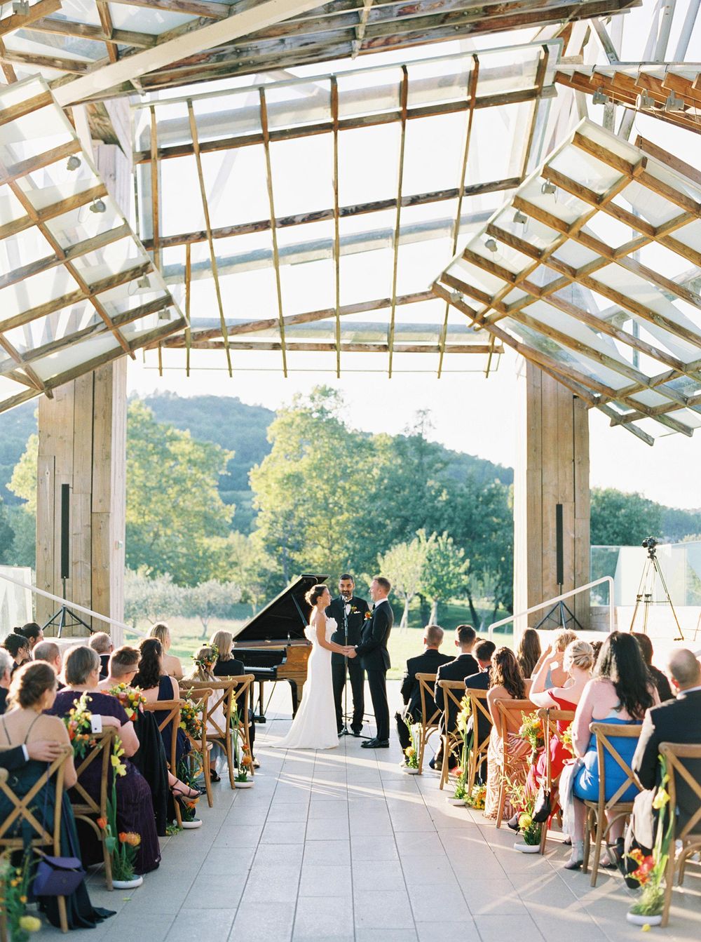 A beautiful outdoor wedding at a winery, with vineyards and a picturesque backdrop.