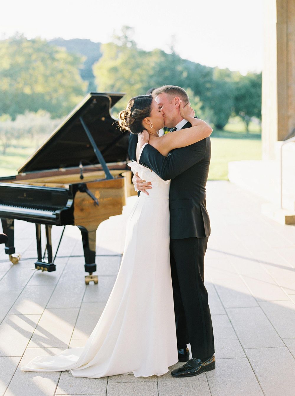 Bride and groom kissing on their wedding ceremony in Château La Coste, Provence