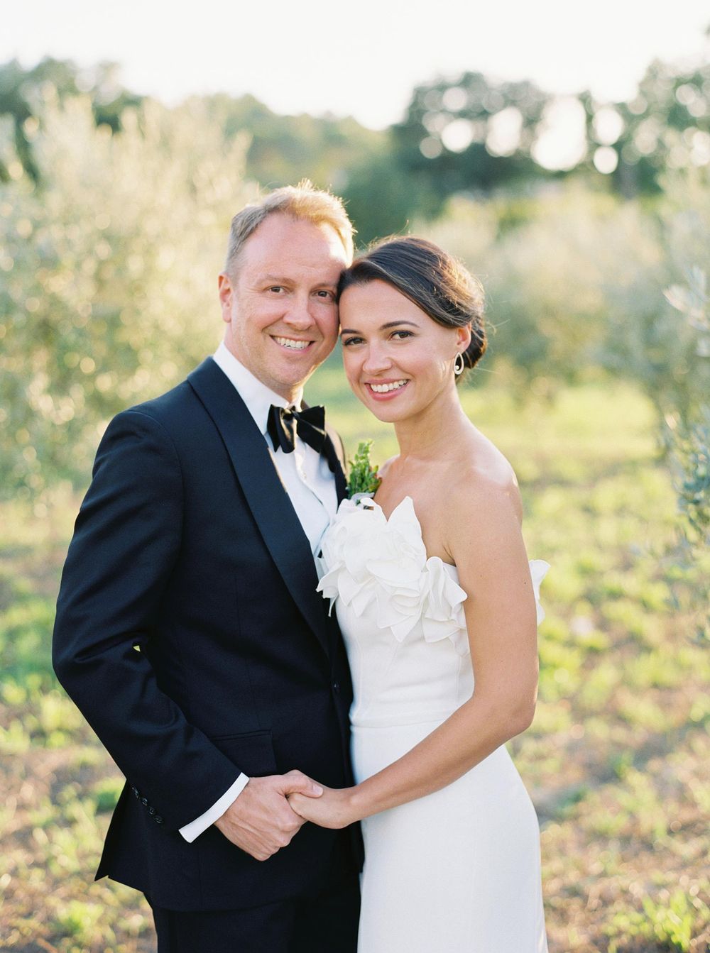 Romantic wedding portrait amidst olive trees at Château La Coste, Provence.