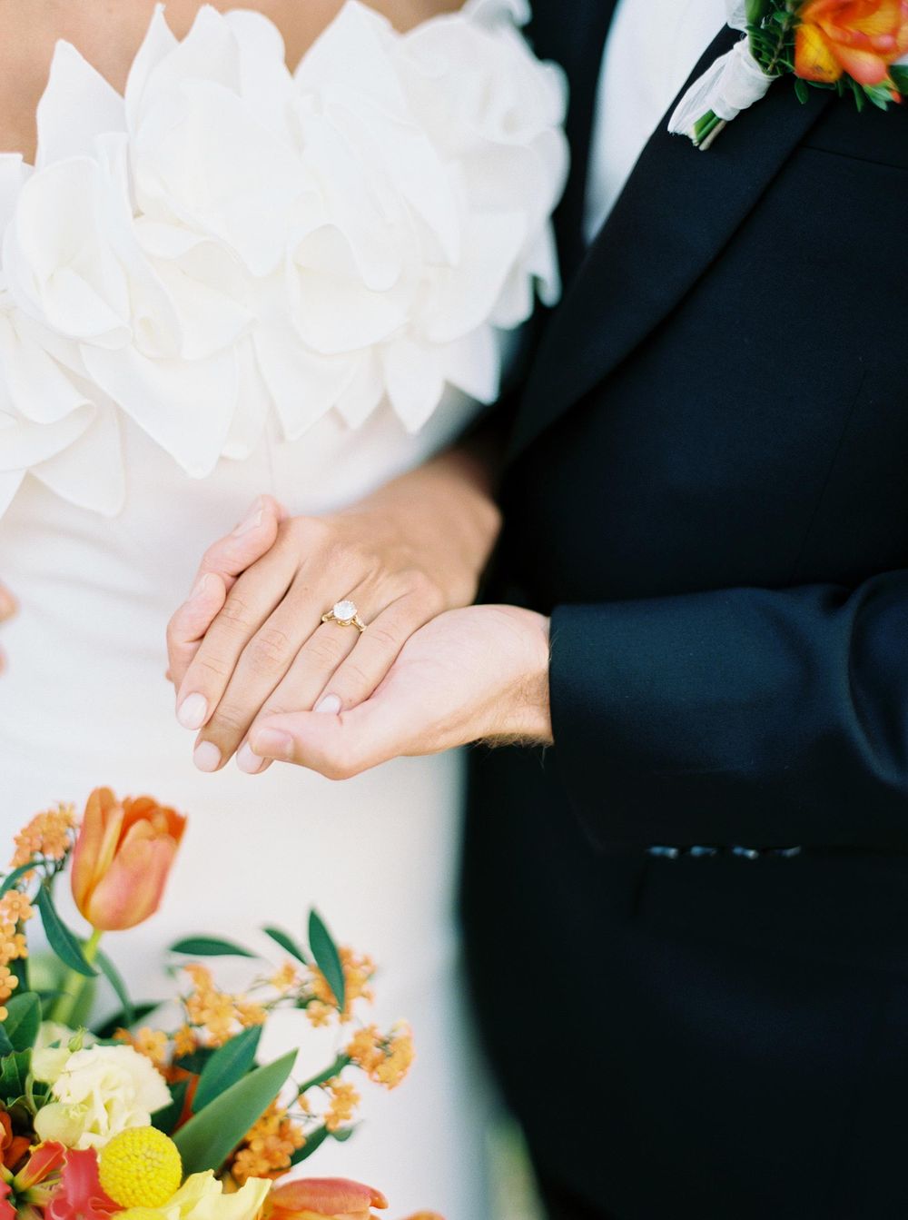 Wedding rings nestled amidst blooming flowers in a serene garden setting. A symbol of eternal love and commitment.