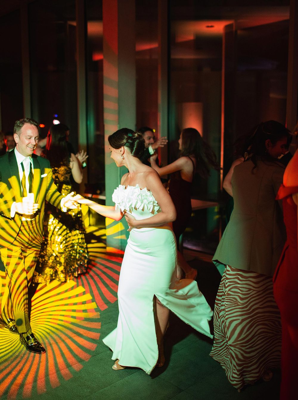 A joyful newlywed couple gracefully dancing together at their wedding reception.