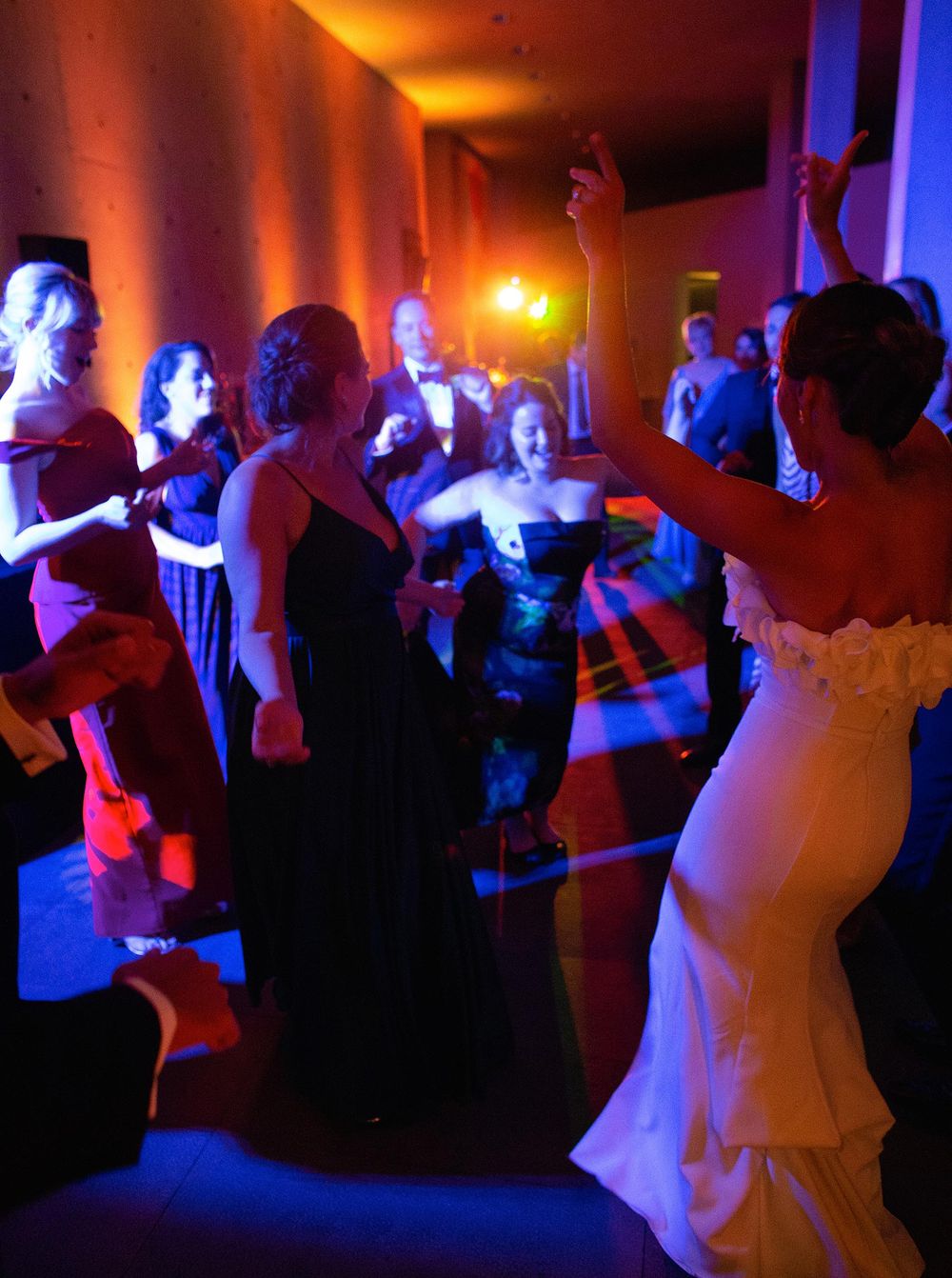 Newlyweds elegantly dancing in celebration at their wedding reception.