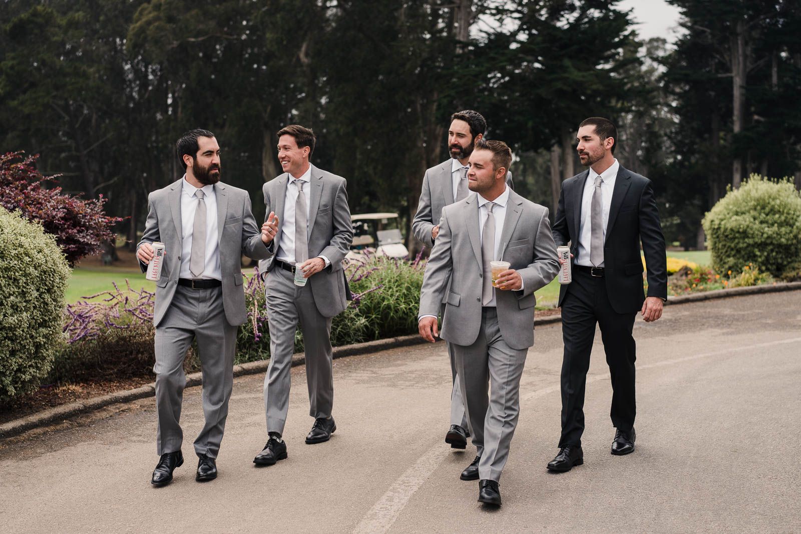 Groom and groomsmen walking toward the ceremony