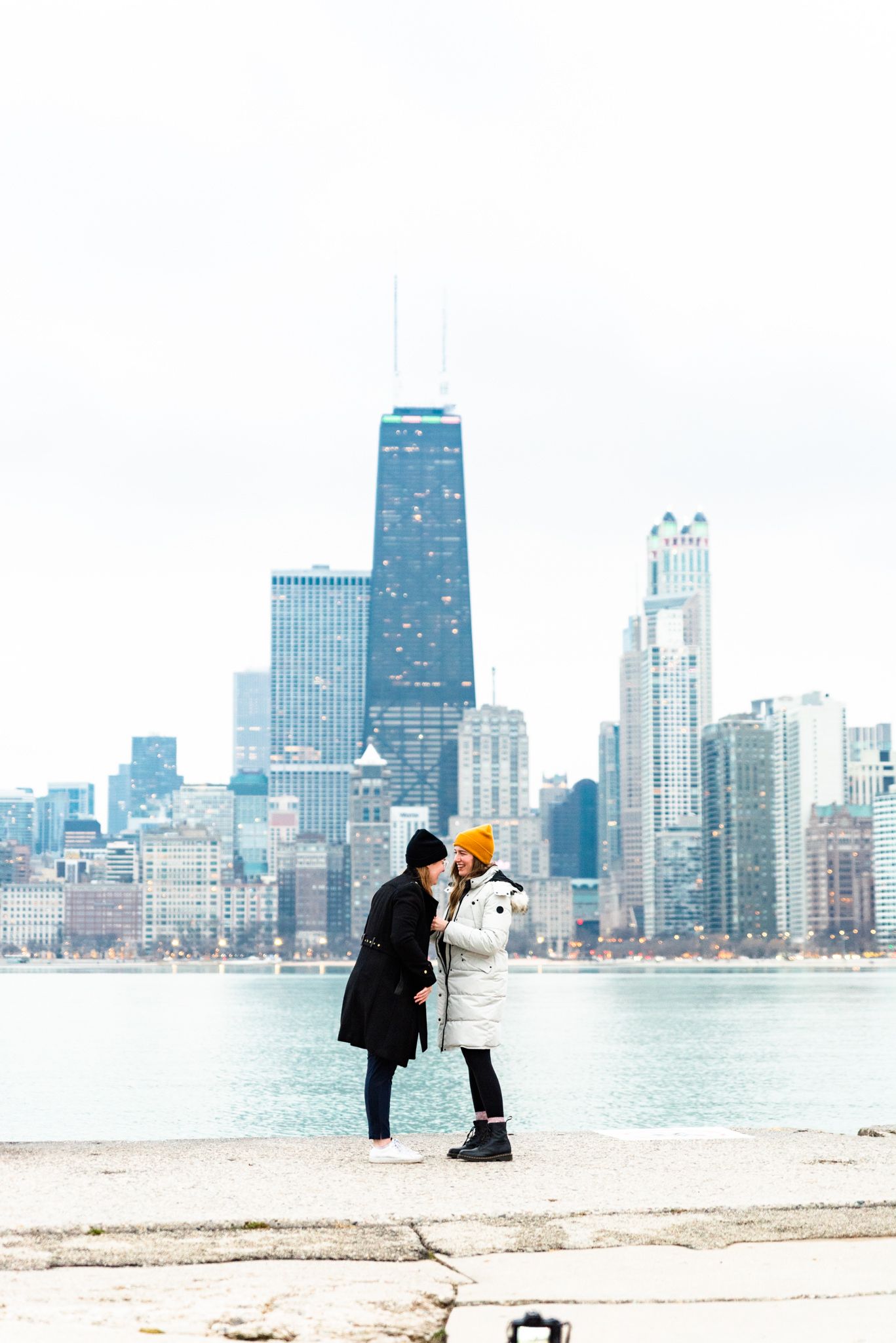 two women get engaged at North Avenue Beach Chicago pier