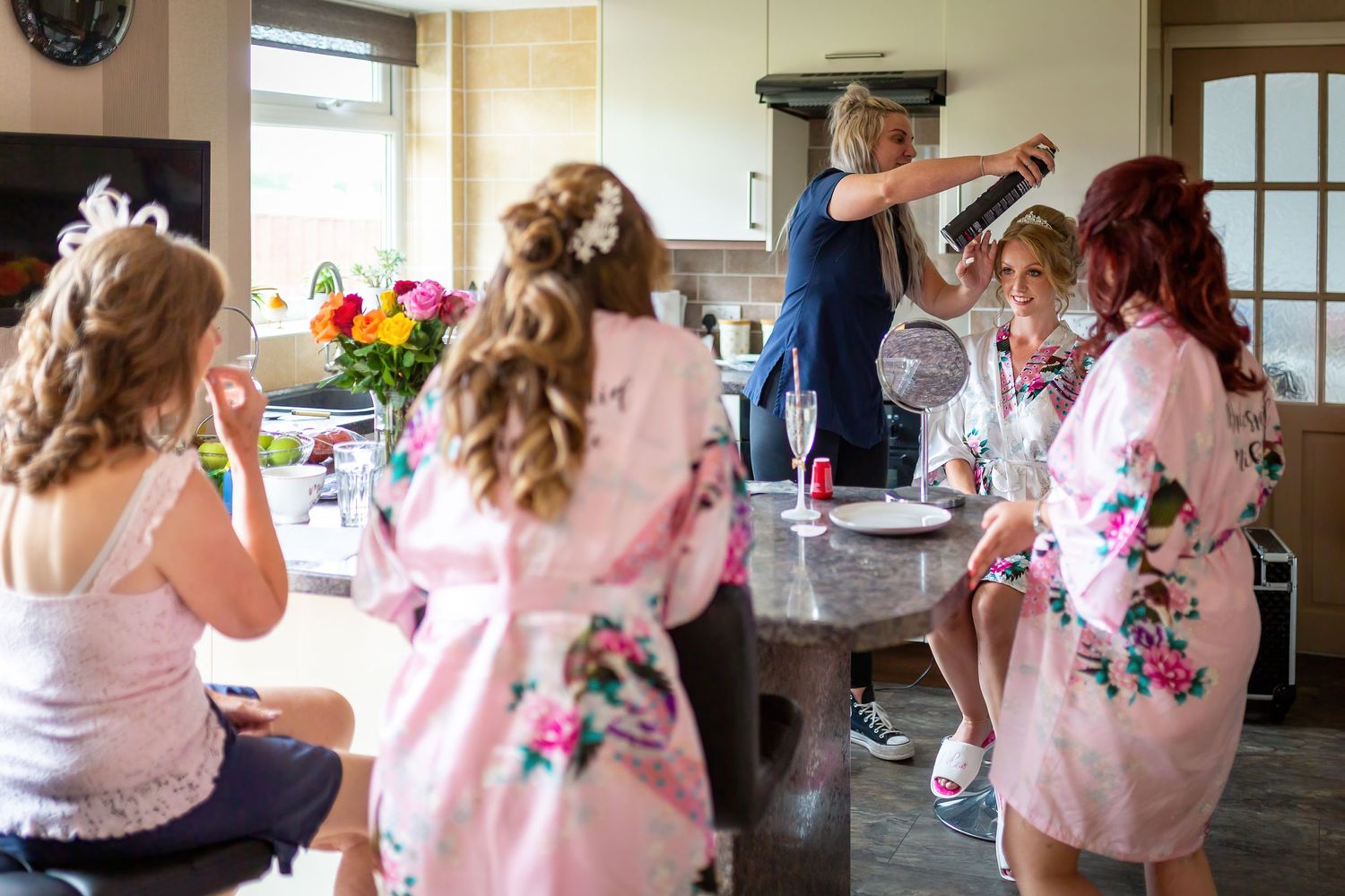 Bride and Bridesmaids getting ready in the kitchen during the wedding morning