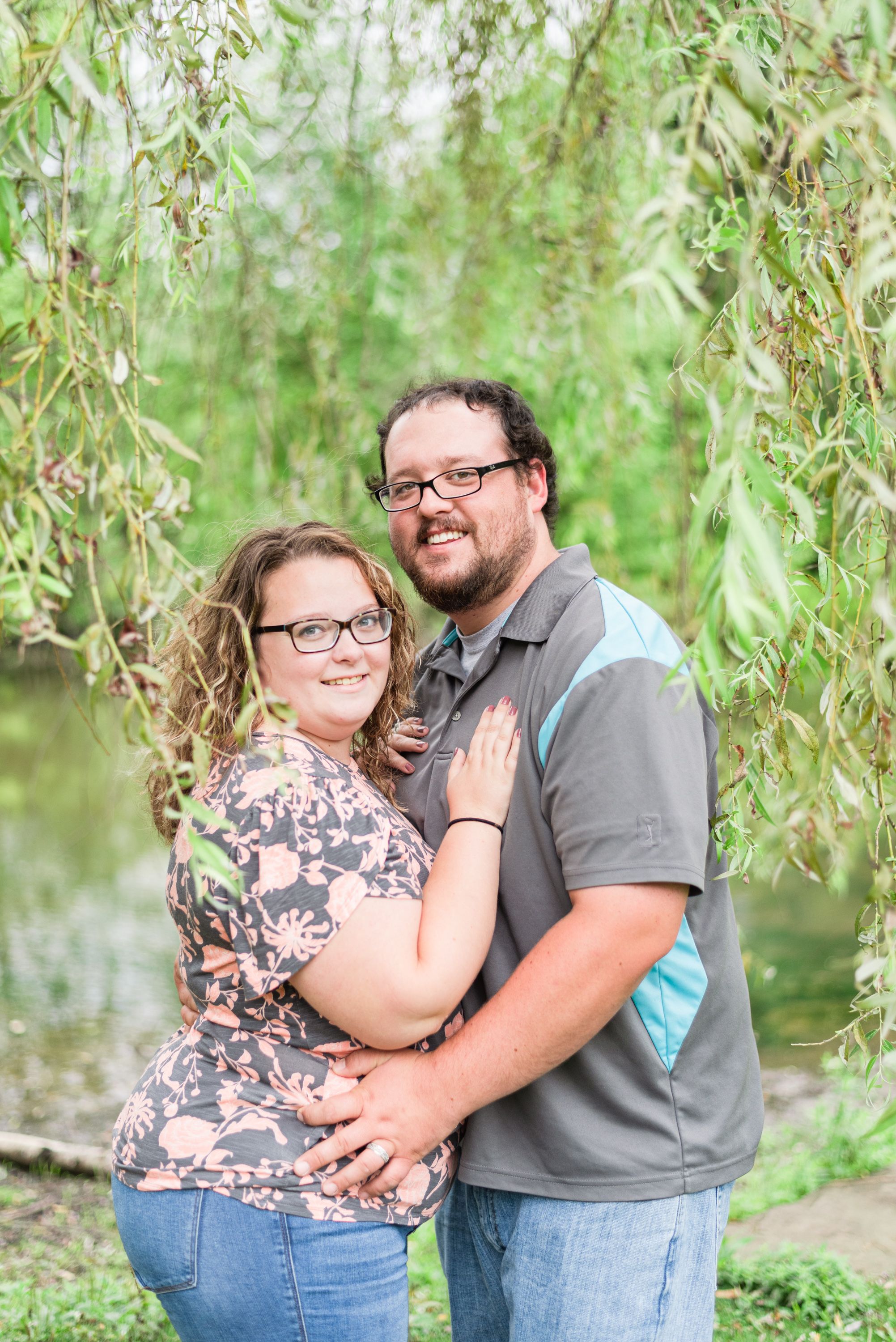 Couple standing under willow tree at Succop Conservancy in Butler Pennsylvania
