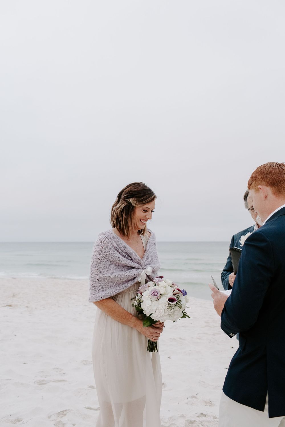 woman laughing during her sunrise Florida beach elopement