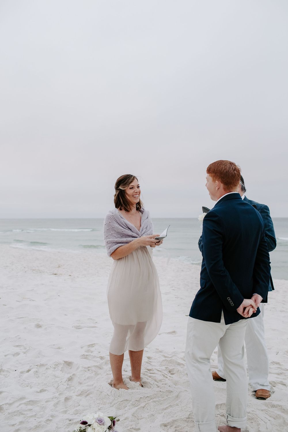 woman saying her vows during her sunrise Florida beach elopement