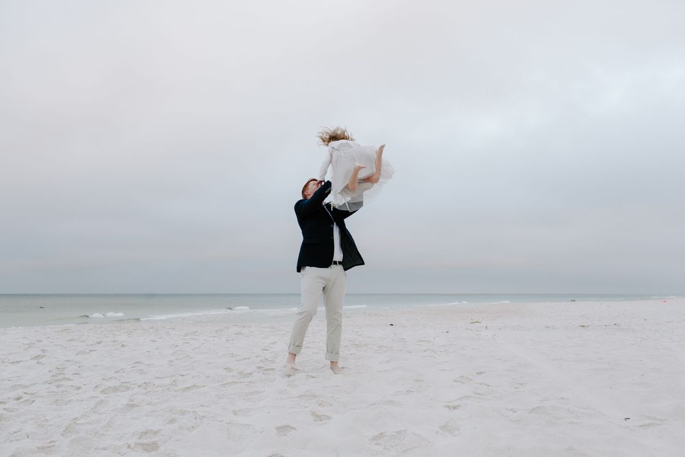 man tossing his new step daughter after his Florida elopement