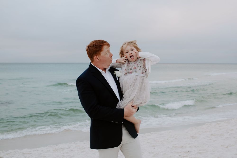 man and his new step daughter after his sunrise beach elopement