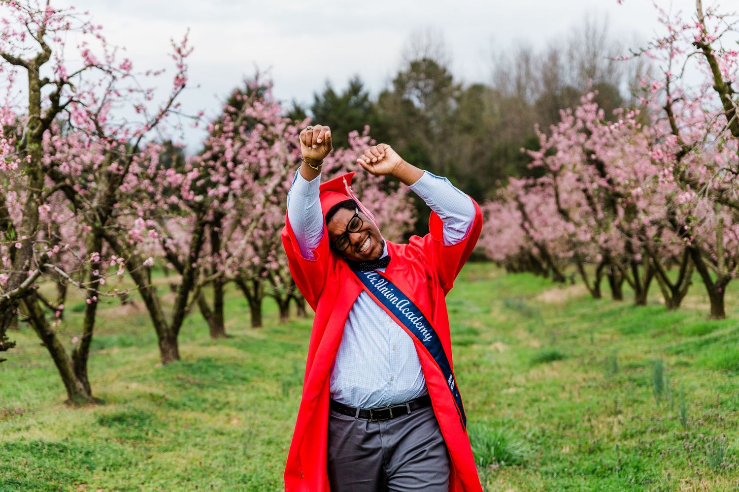 Cap and gown photo in peach orchards in Fort Mill, SC