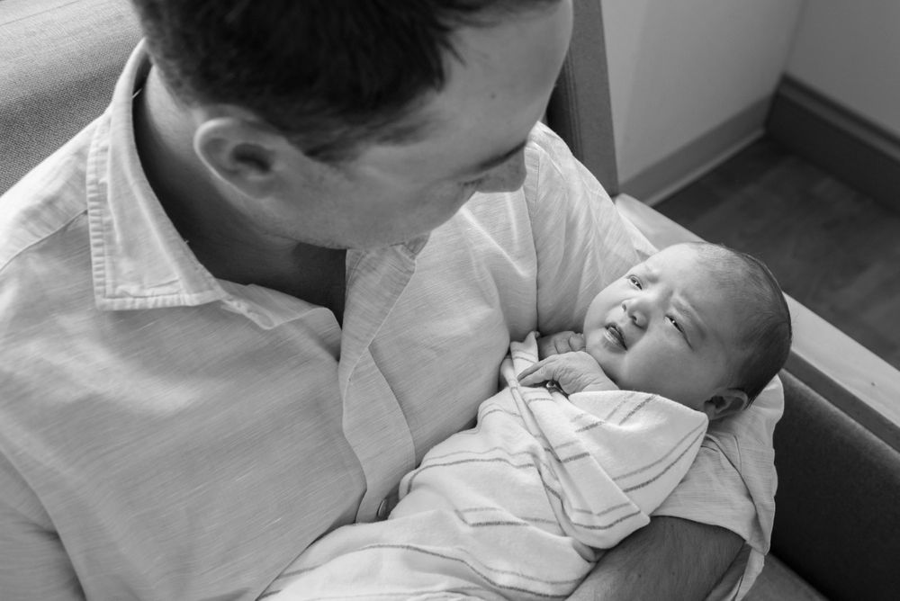 First moments with newborn baby captured in a Fresh 48 session by Heidi Harting Photography in Plymouth, MA