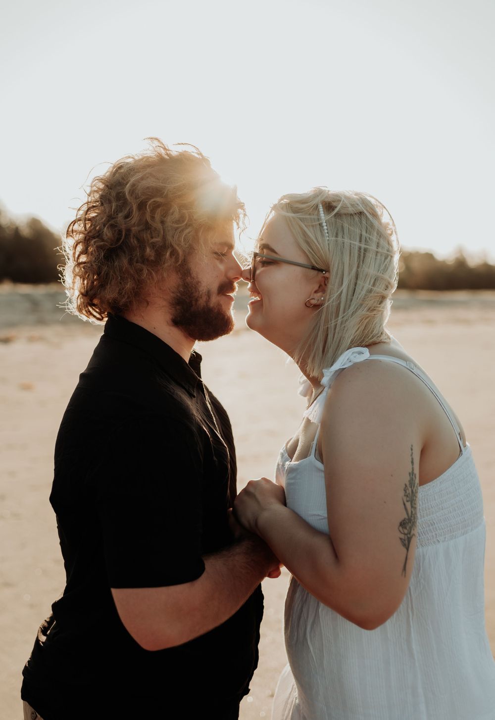 couple touching noses and smiling