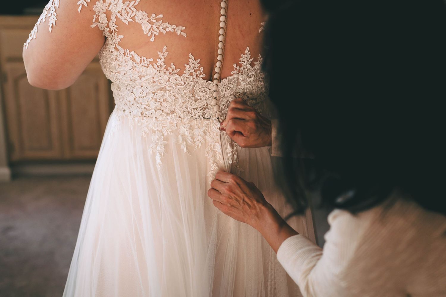 plus size bride back of her lace wedding dress