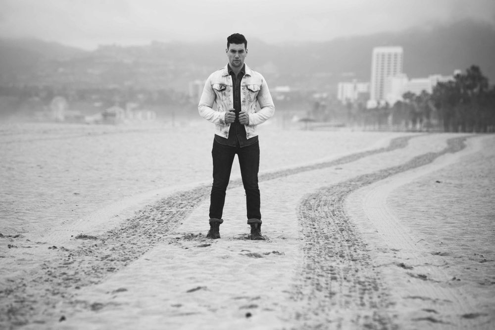 Actor Christian James Levi's Denim Trucker Jacket Jeans Sand Venice Beach Overcast