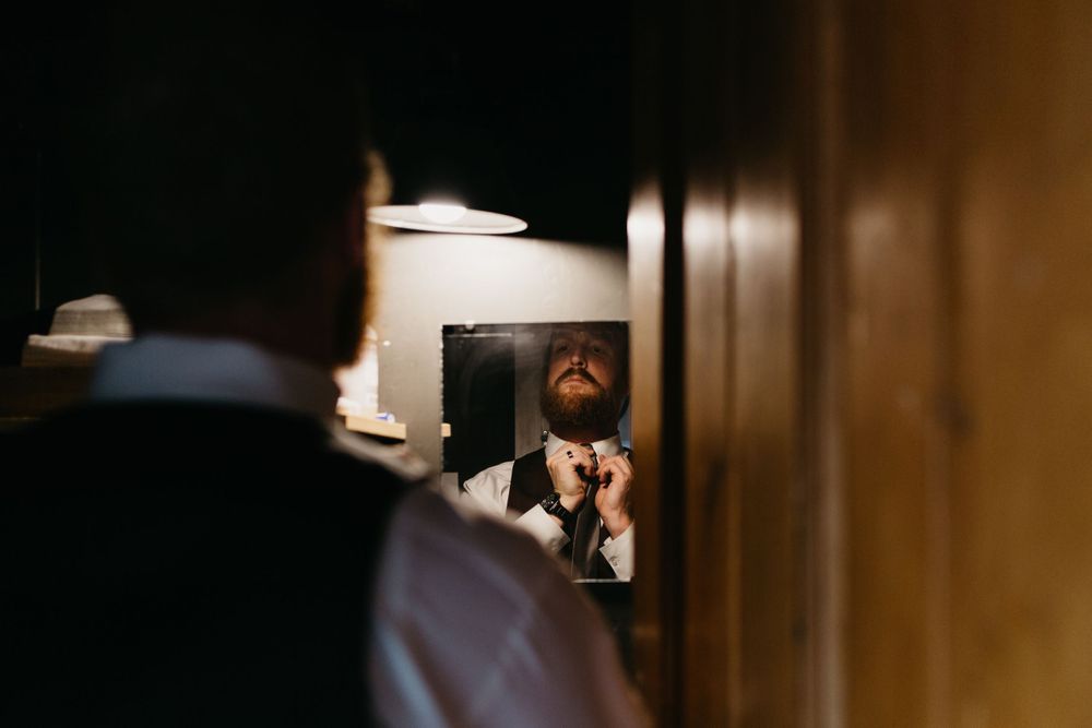 Groom getting ready Bread Bar Silver Plume Colorado