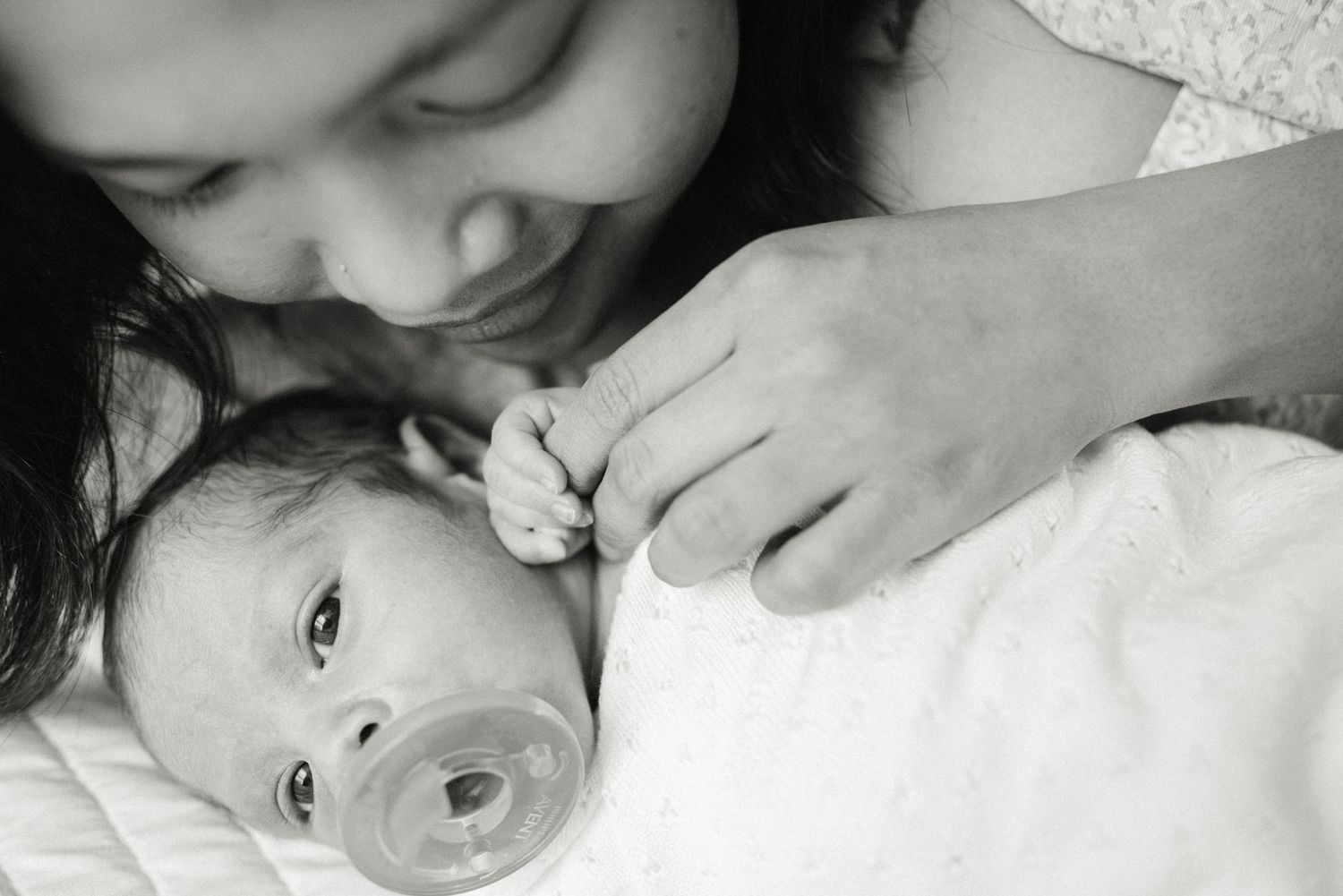 Black and white close-up portrait showing tender family affection.